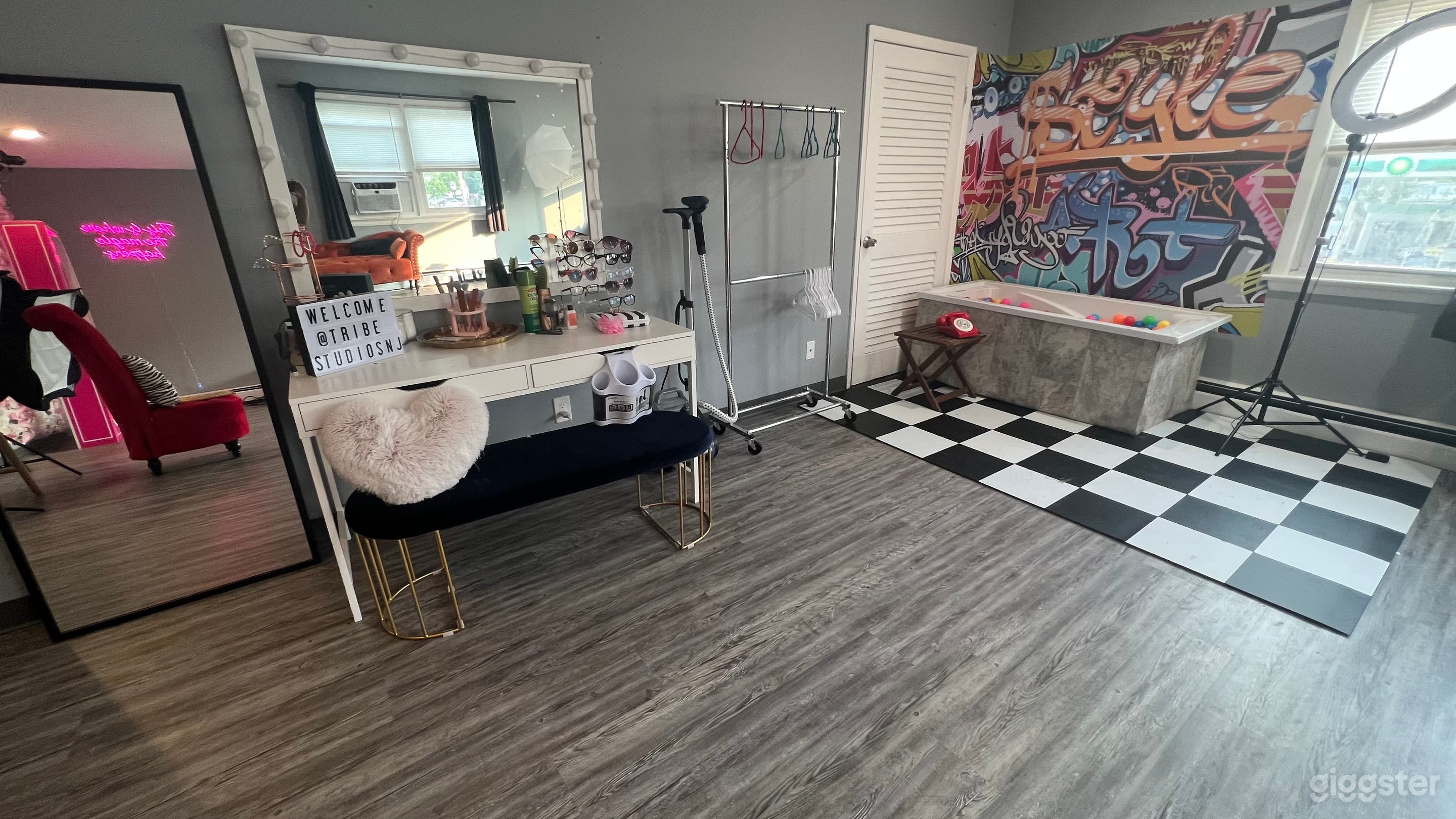 Makeup/hair station, mirror, clothing rack and steamer.