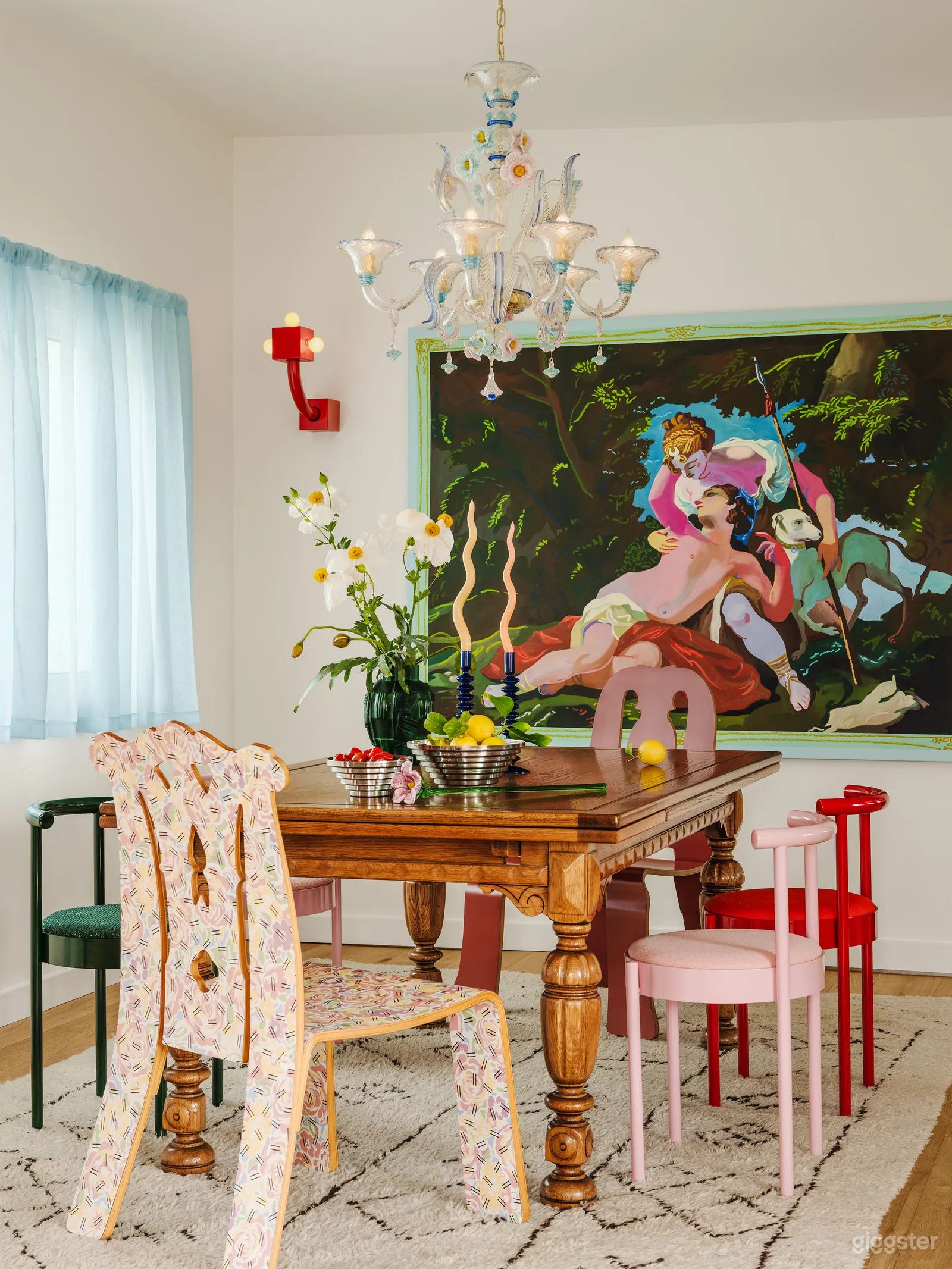 Traditional European dining table with post-modernist chairs
