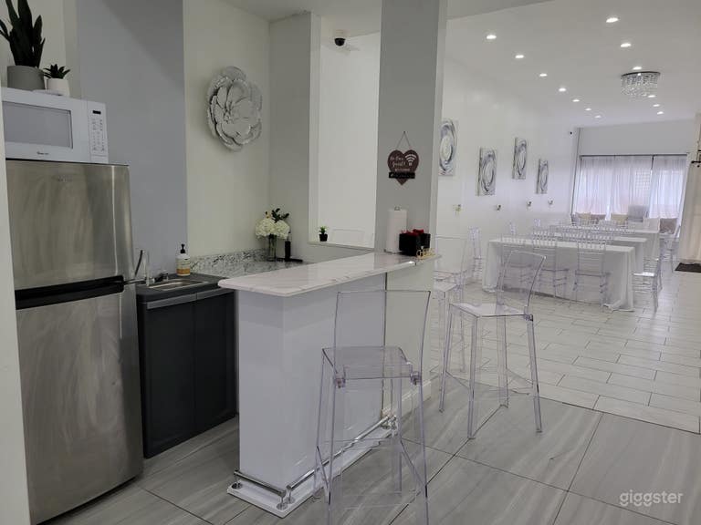  Kitchenette with refrigerator and beverage serving area. 