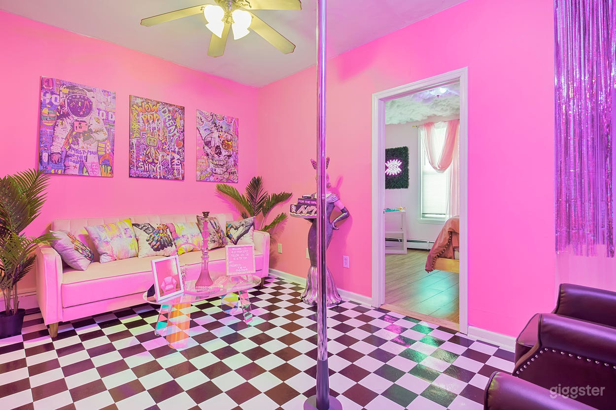 Graffiti lounge room. Common area during split booking. Features colored led Wi-Fi lighting .