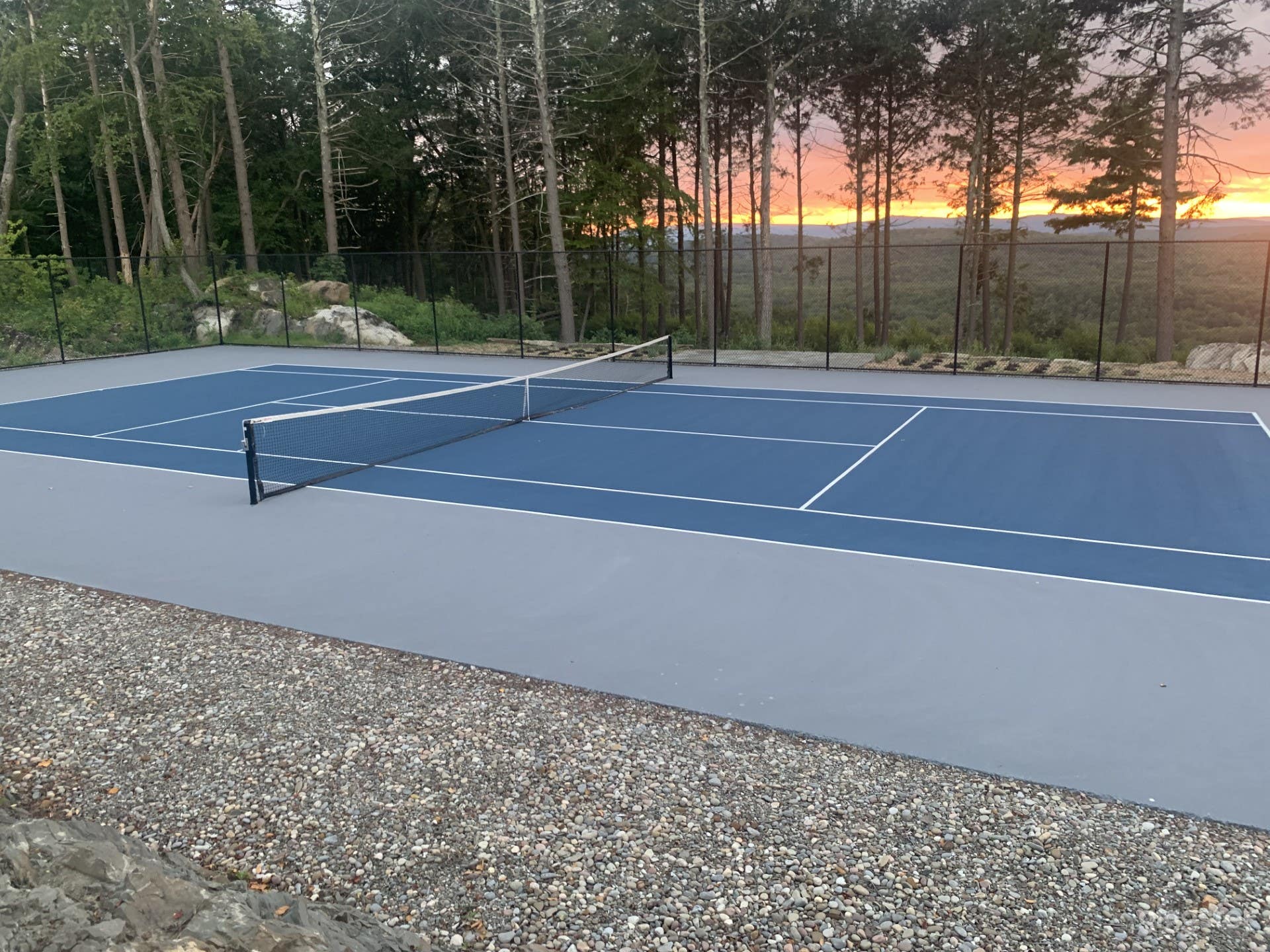 Tennis court with sunset
