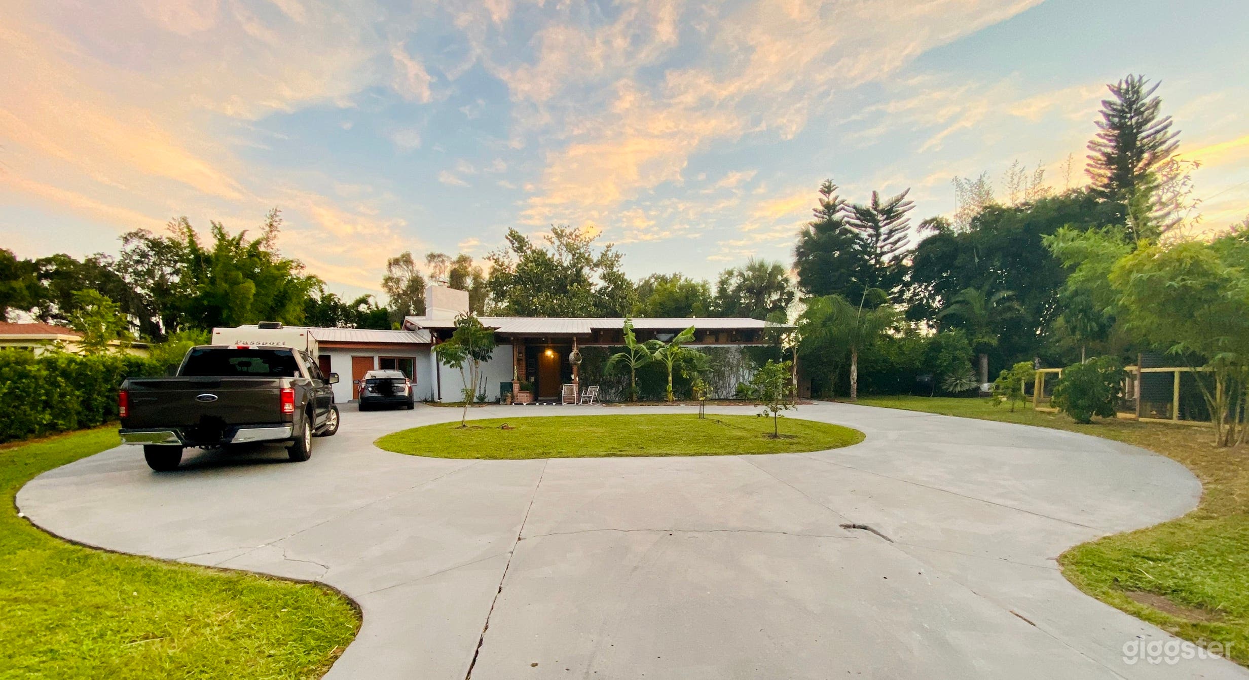 Front circular concrete drive with lots of parking. Additional parking across the street