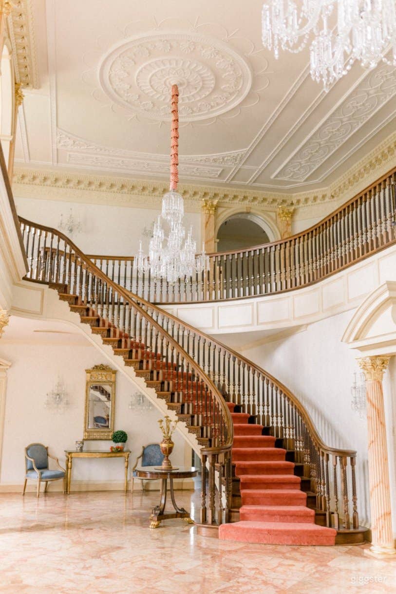 Marble foyer with twin curved staircases