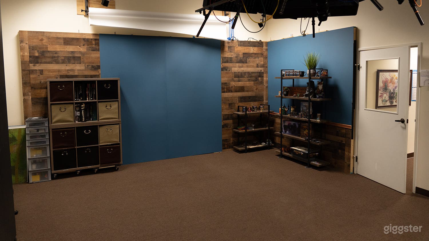 Main shooting wall with Blue and Wood style background.  Shelves included or moved out of the way.