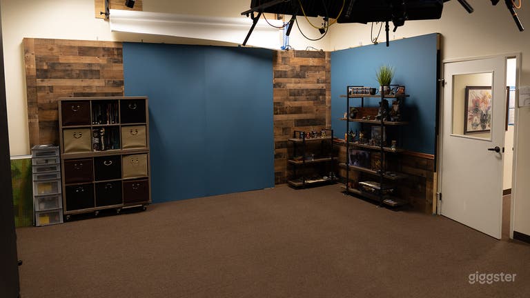  Main shooting wall with Blue and Wood style background.  Shelves included or moved out of the way. 