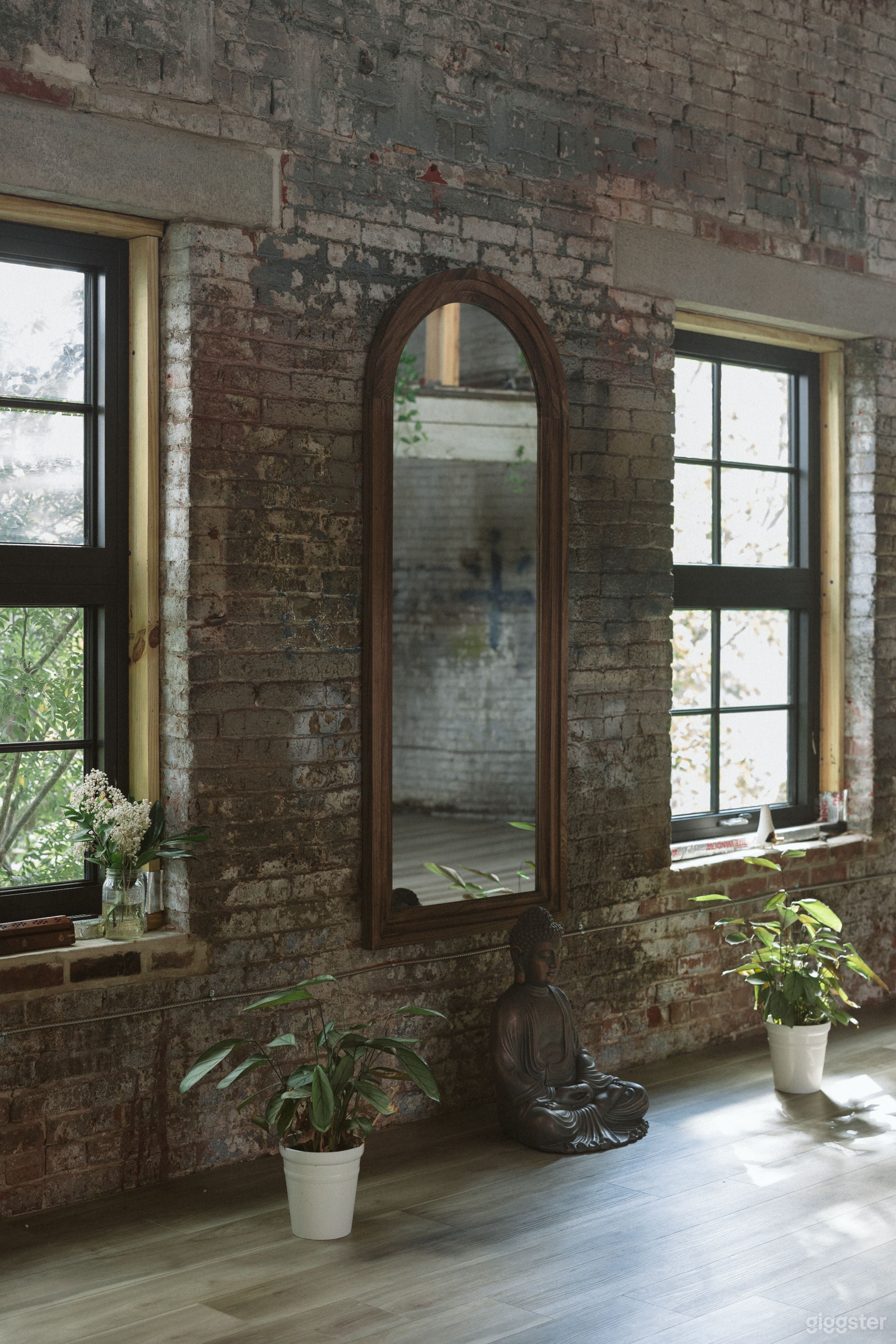 Sunlit Urban Oasis with Exposed Brick + Beams Photo 2