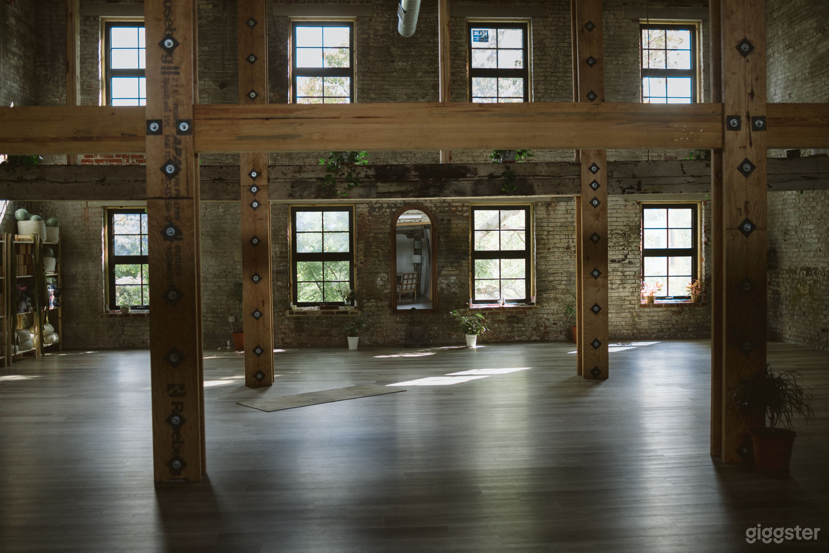 Sunlit Urban Oasis with Exposed Brick + Beams Photo 1