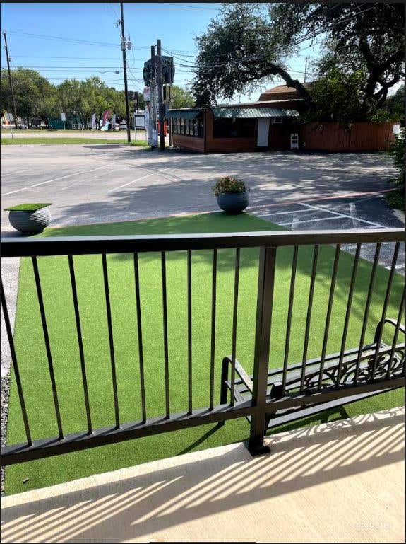  Serene outside greenery that is used for yoga sessions 
