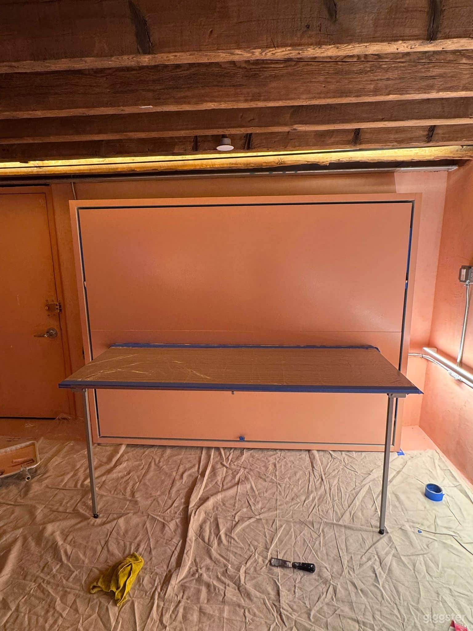 murphy bed with collapsible table. 