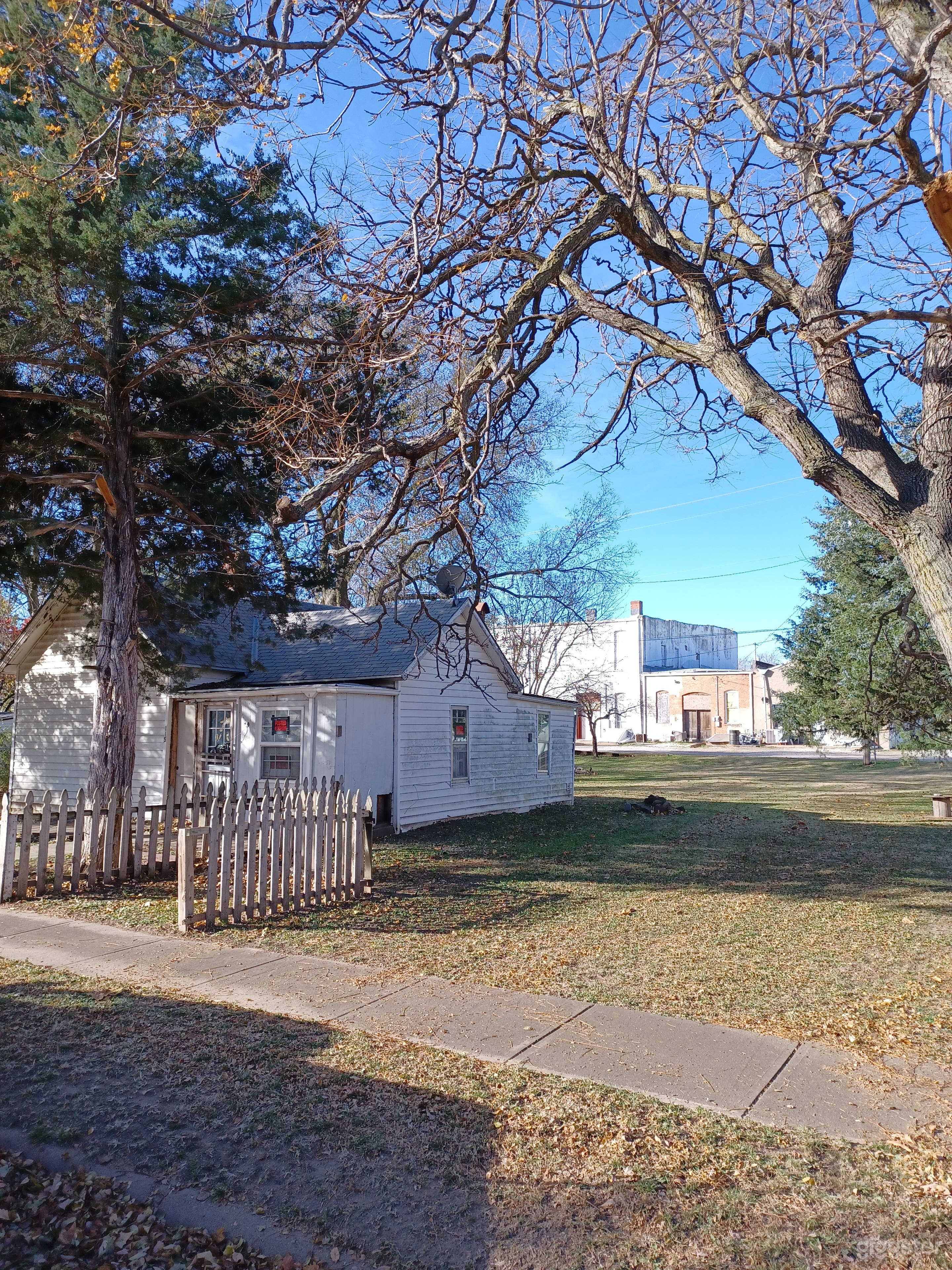 One perspective view of properties taken on the corner of property line. 
