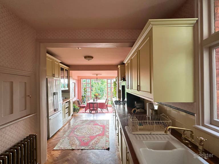  Full length of kitchen from doorway, showing serving hatch into second reception room 