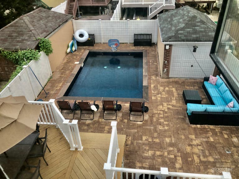  Large yard with new inground pool and neutral toned pavers  