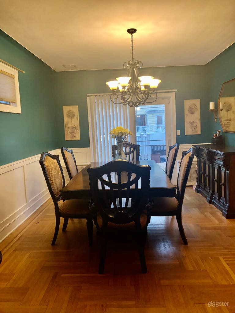  Dining room with traditional parquet floors and wainscoting on walls 
