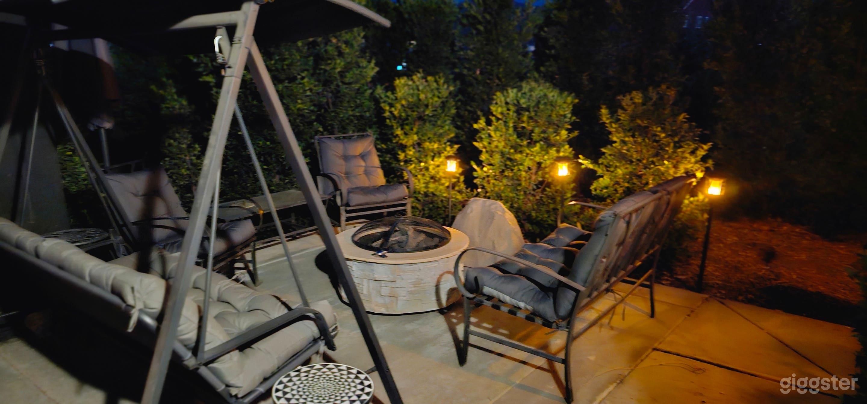 Manor entrance, with swing, seating and firepit