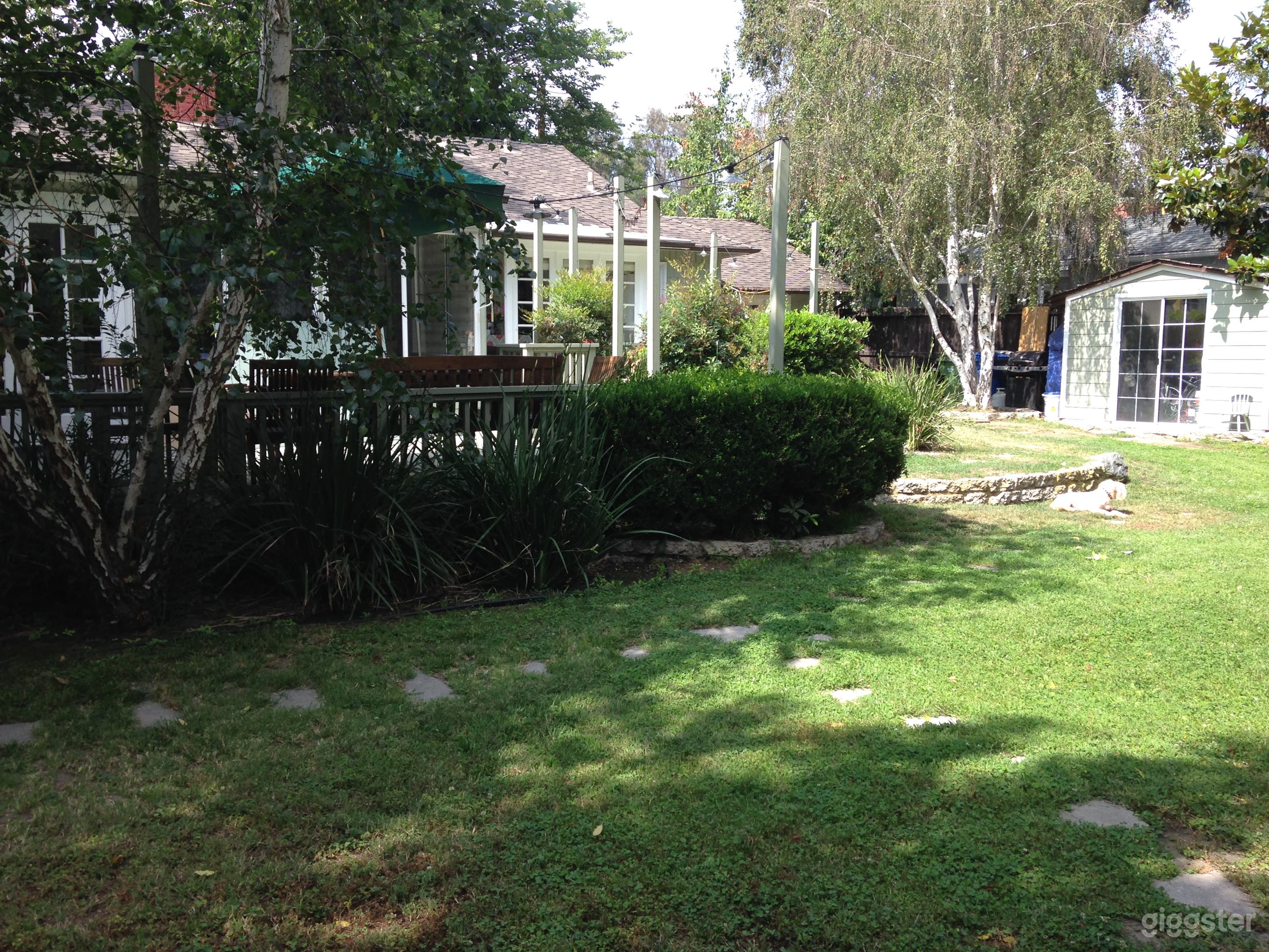 Backyard, wrap around deck plus large outdoor eating area and smaller area off the kitchen nook.