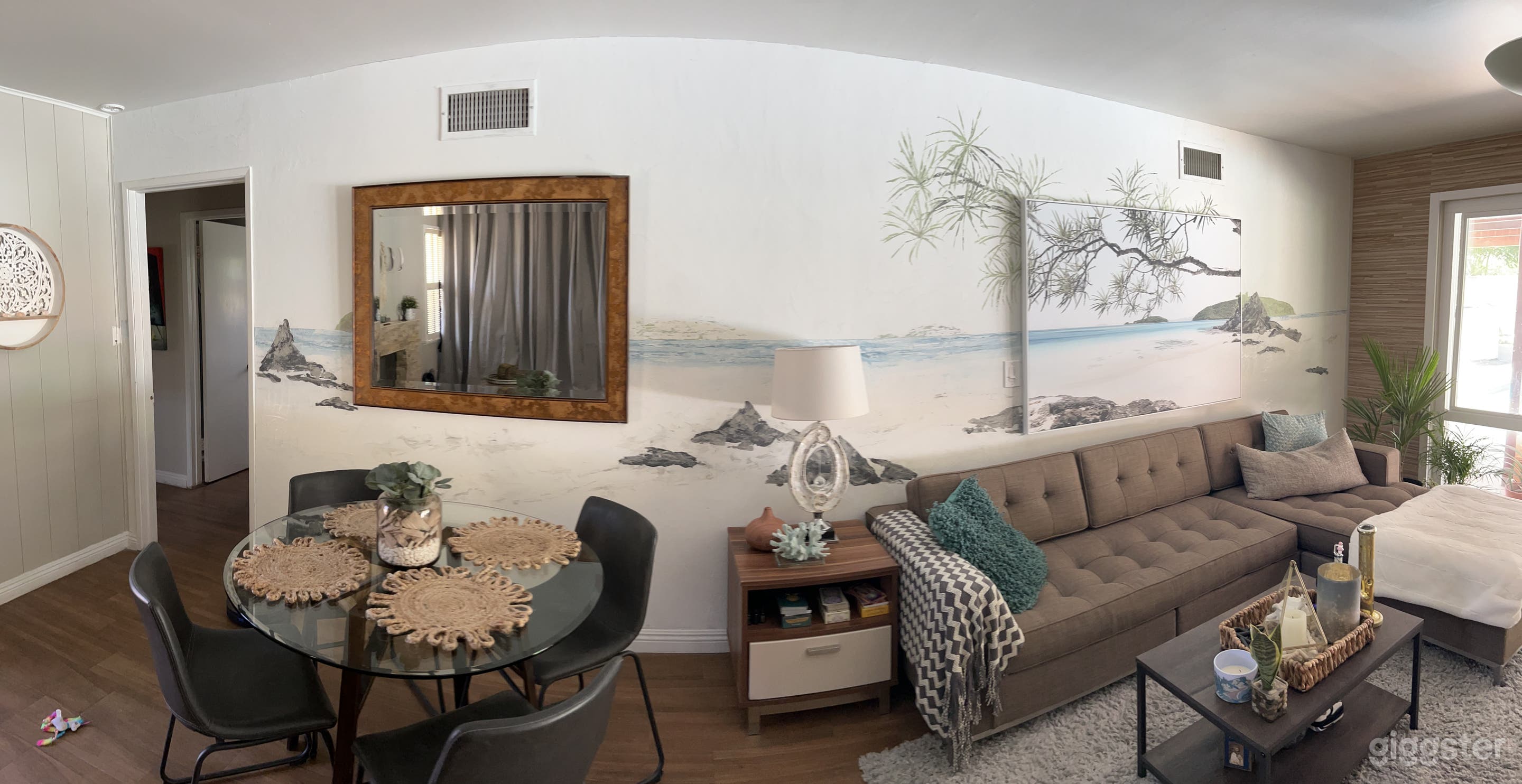 Living and eating area is open layout with 20 ft. beach mural as background.