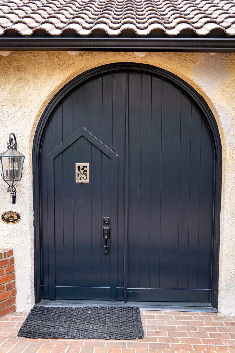  Exterior shot of large front doors which include wicket door 