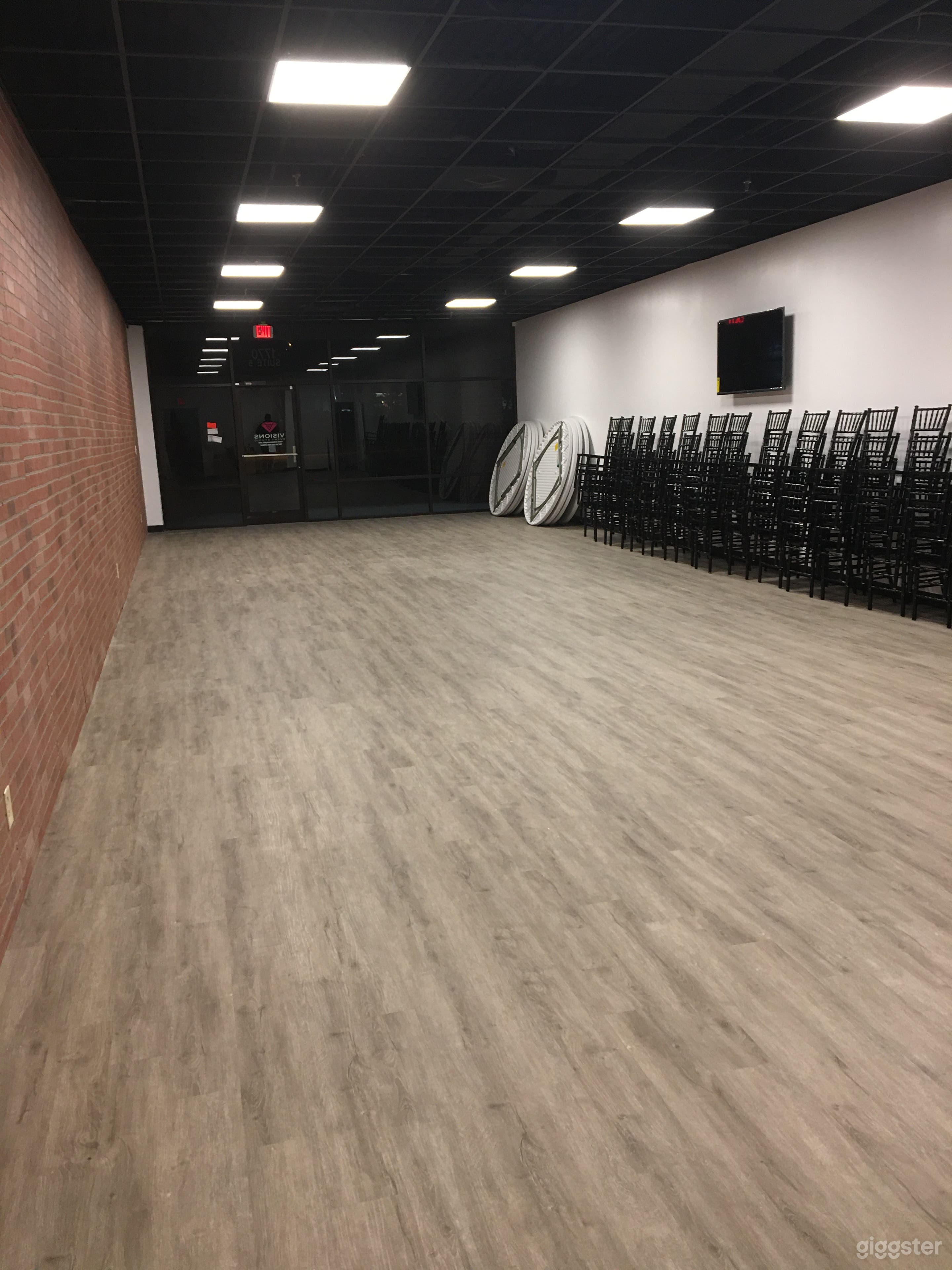 Event/studio space w/brick wall, black ceiling Photo 2