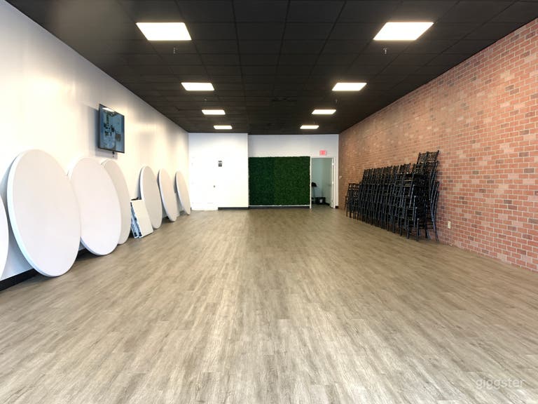  Event/studio space w/brick wall, black ceiling 