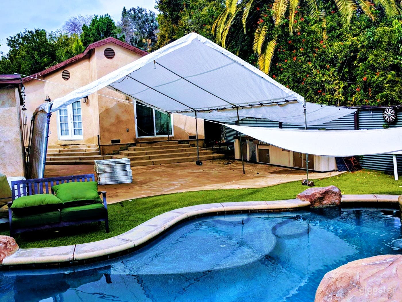 Tranquil Pool with a Waterfall and Event Lounge  Photo 1