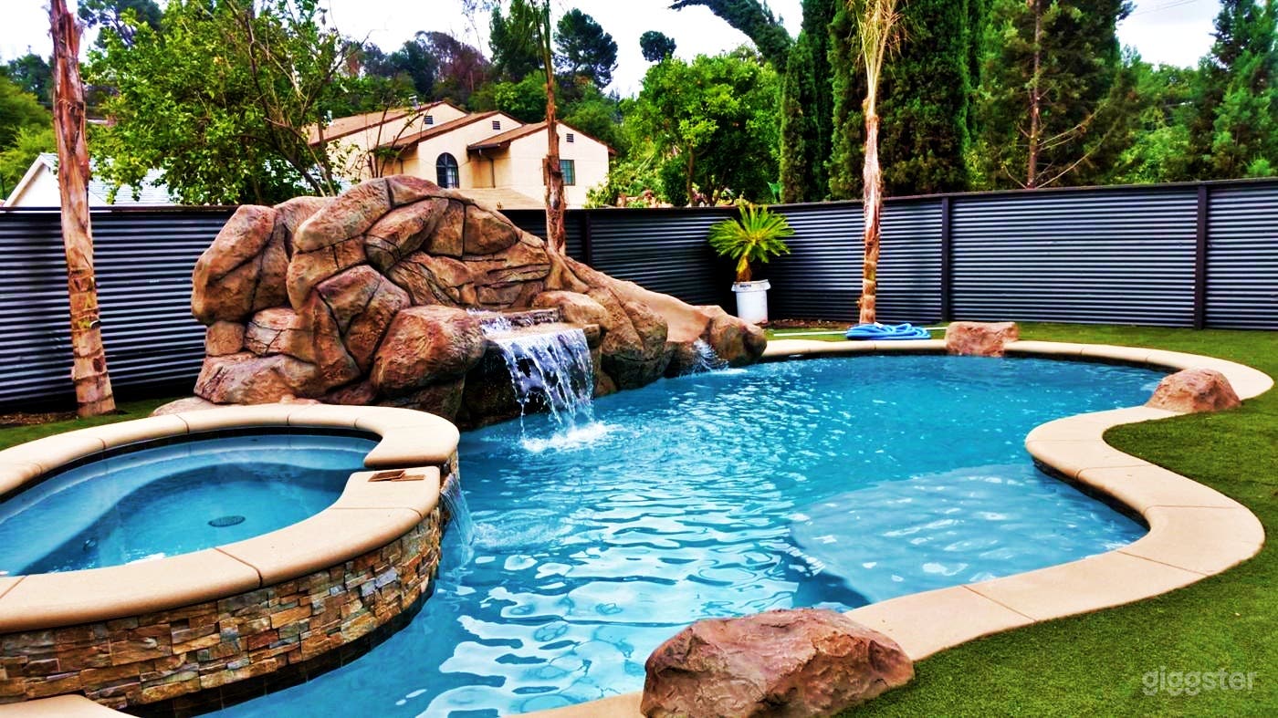 Tranquil Pool with a Waterfall and Event Lounge  Photo 2