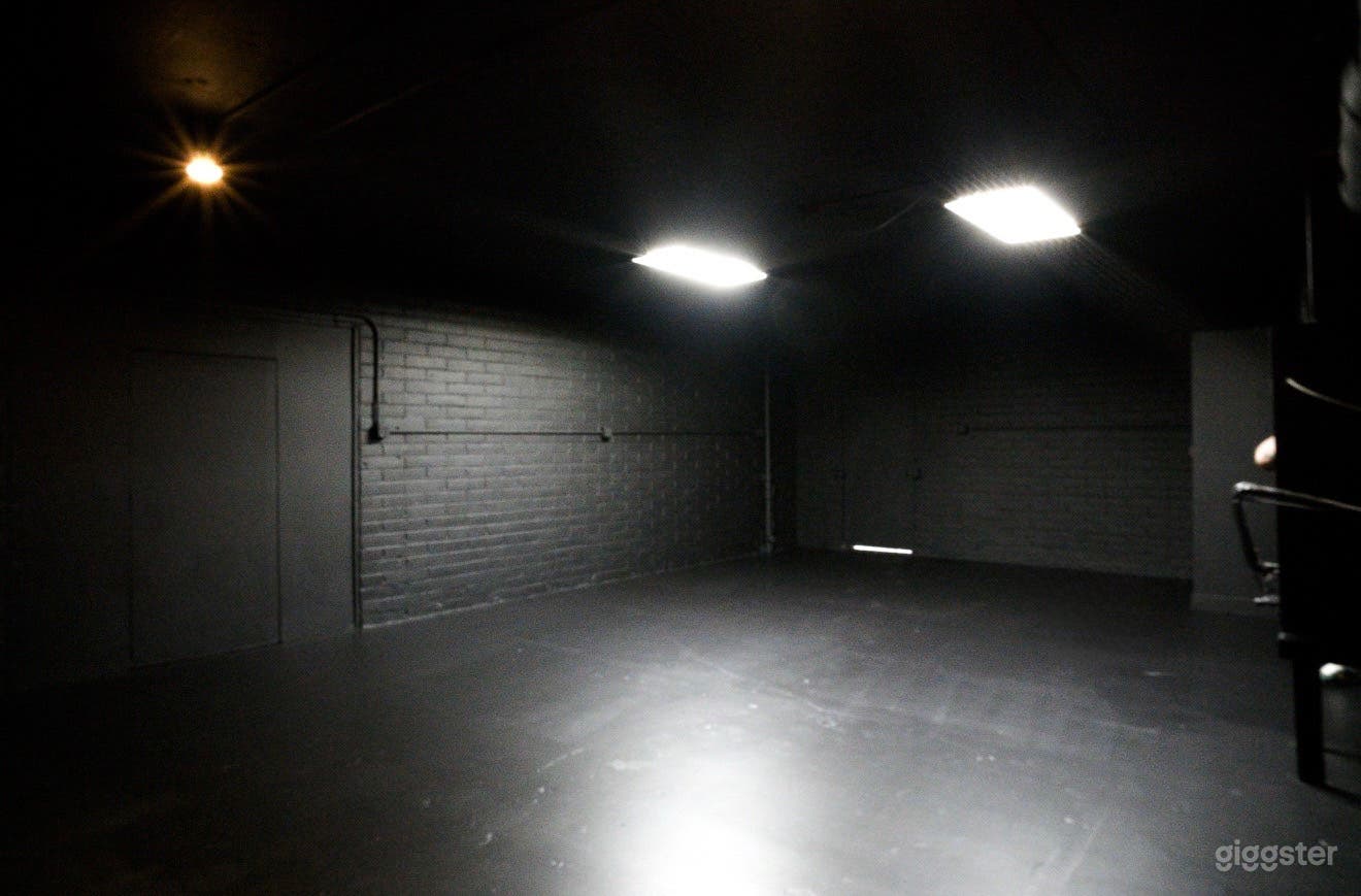 Blacked Out Warehouse Space With Front Loft Style Bedroom Photo 1