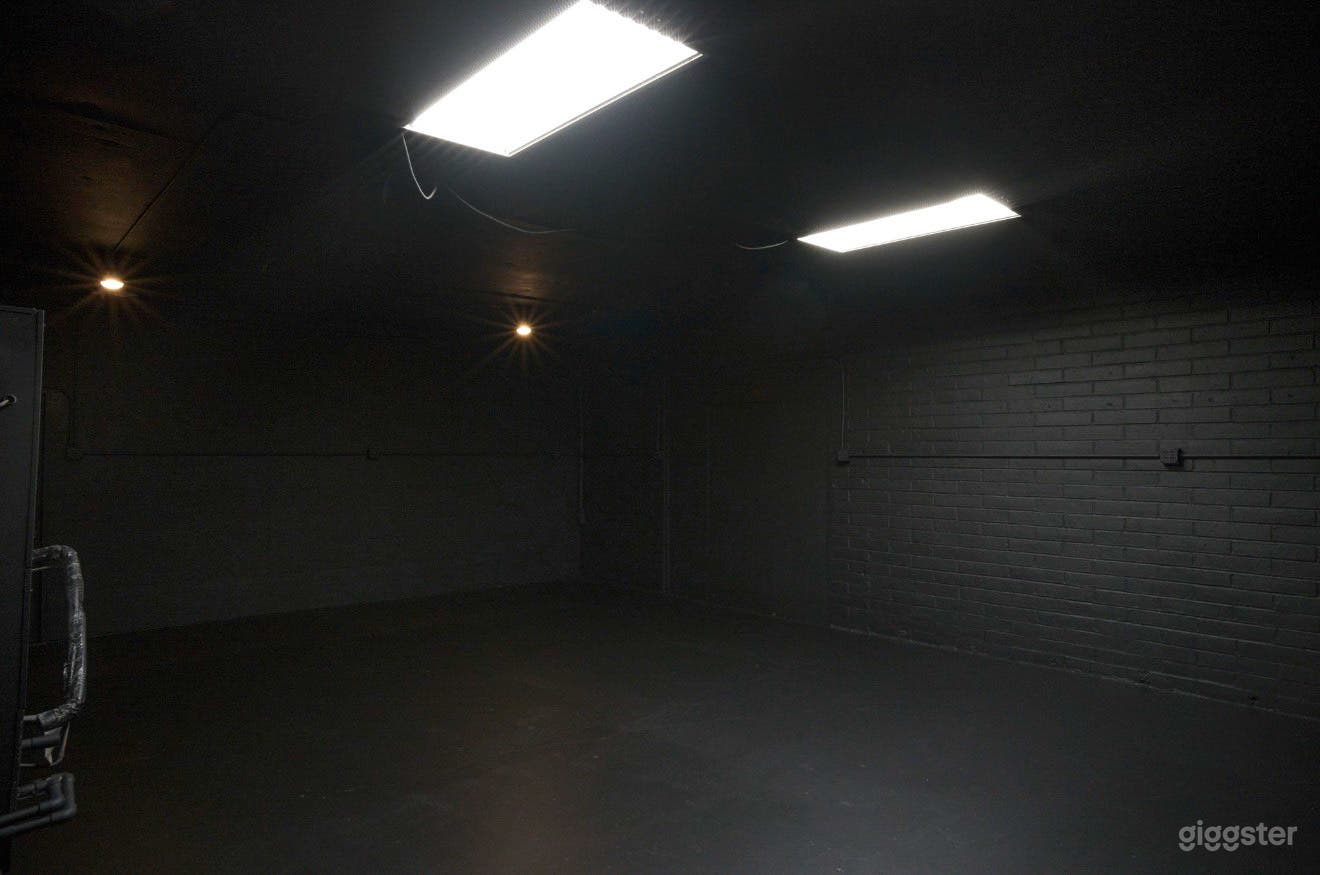 Blacked Out Warehouse Space With Front Loft Style Bedroom Photo 2