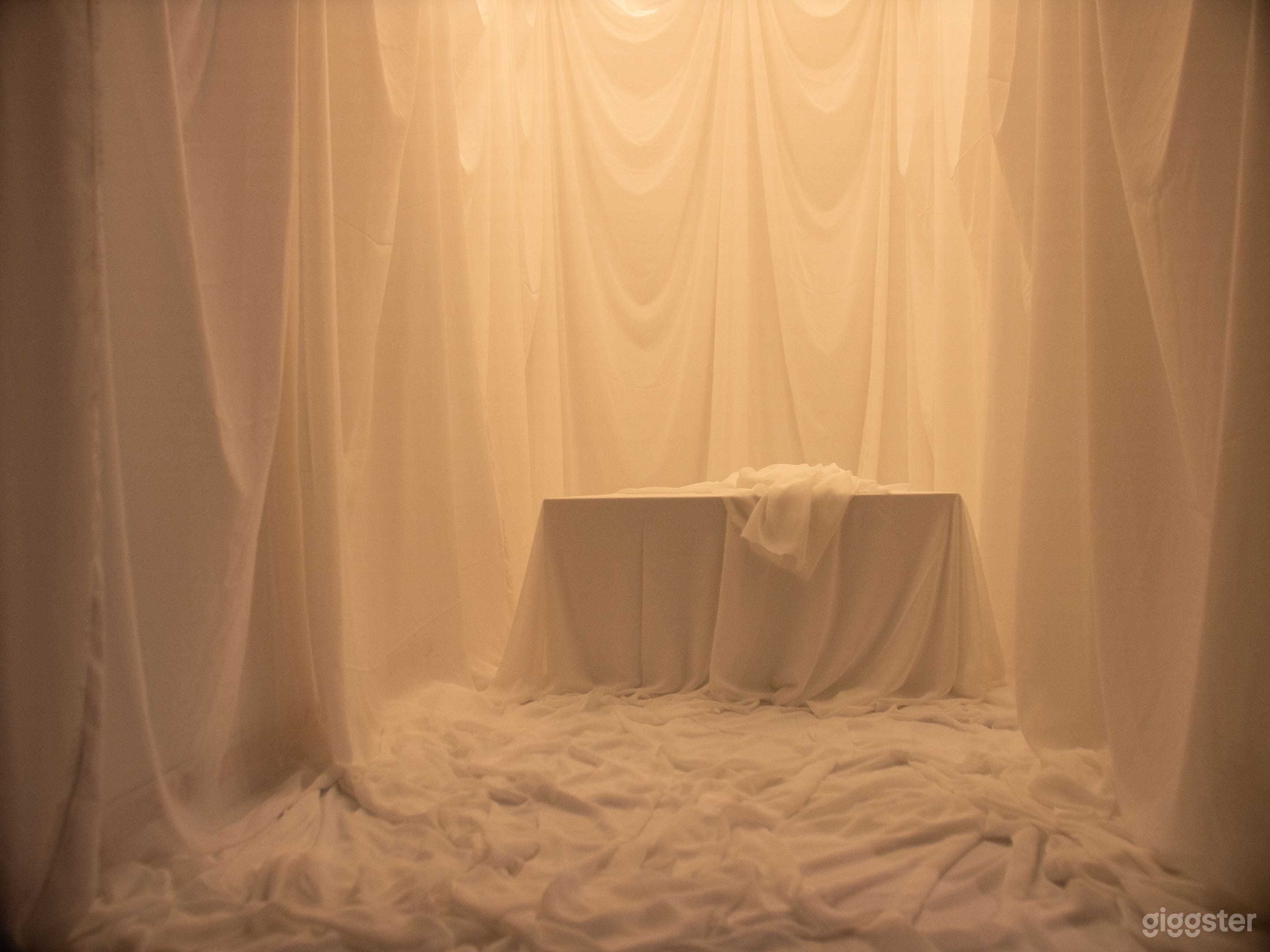 Chiffon cloud set. Platformed seat and hue lighting overhead for color change.