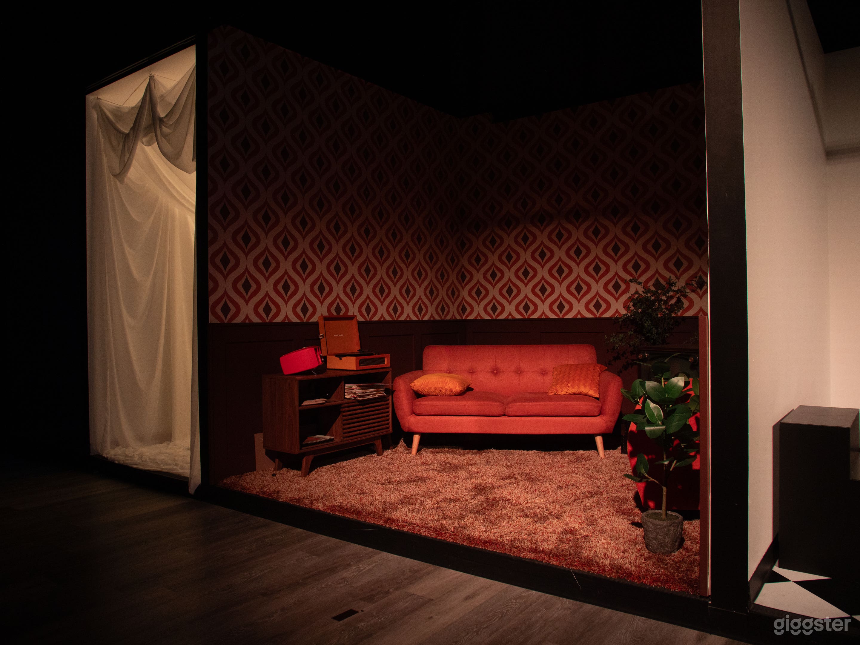 70's set. Retro TV and furniture with shag carpet and wainscot.  