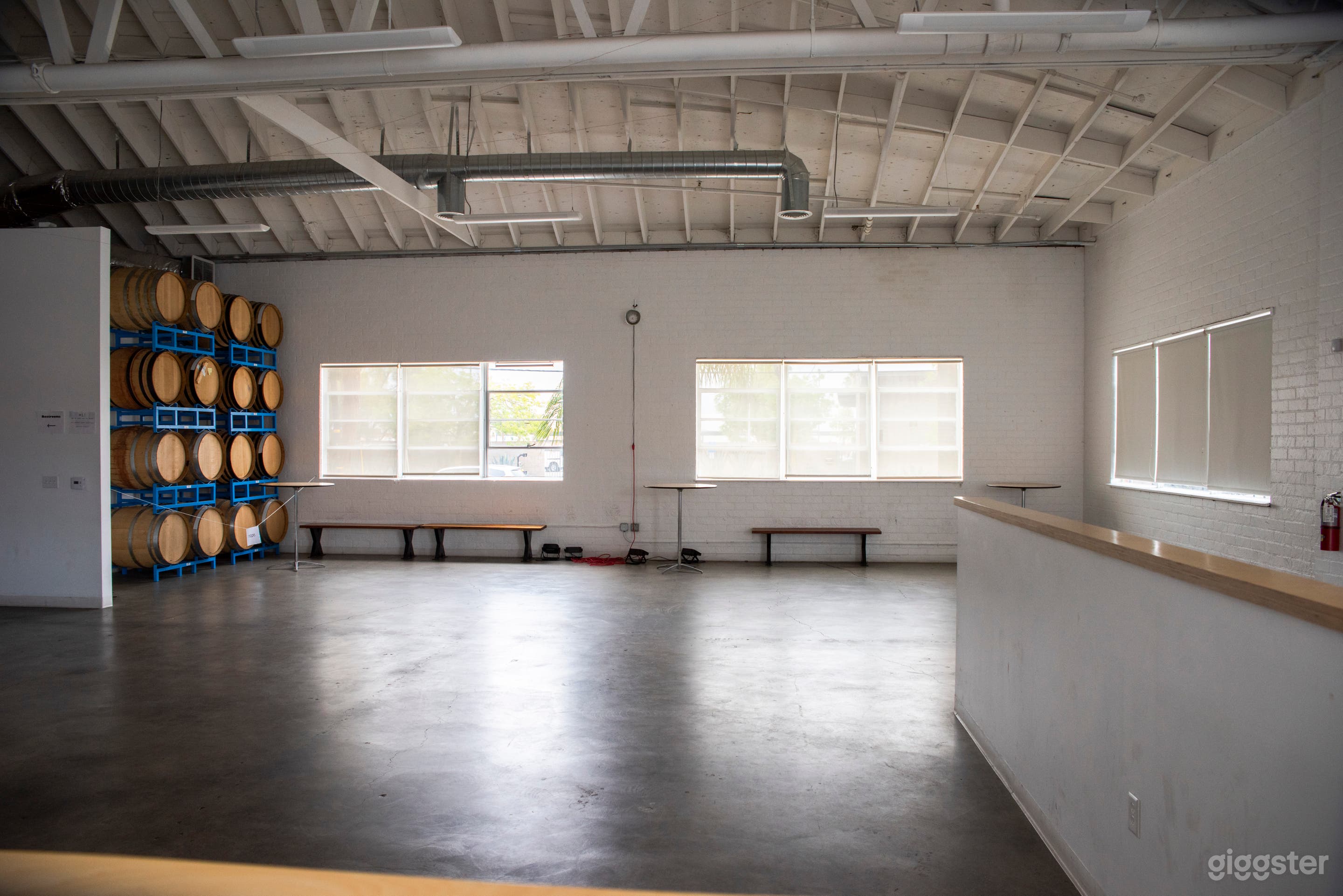 The Gallery - Concrete floors, high ceilings, white walls, beer barrels &amp; clean industrial chic. Customizable space. Air conditioned.
