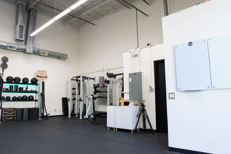  North wall where you can access the breakers along with an array of different electrical plugs from 120V-240V. Also the bathroom door is right next to the electrical panel. 