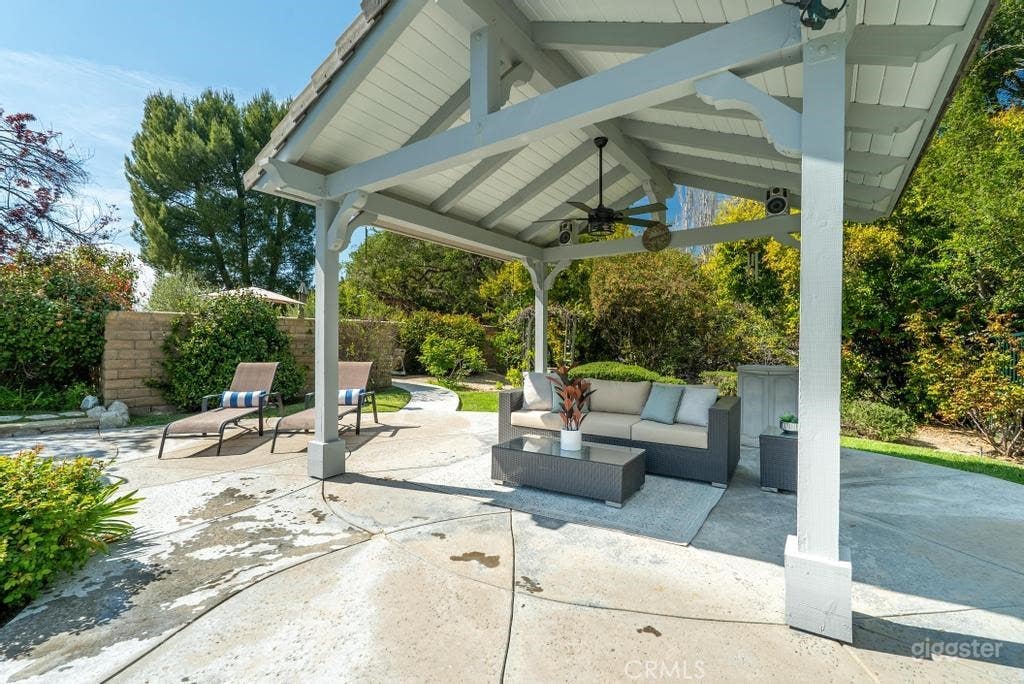 Expansive Outdoor Space with Pool, Lawn, &amp; Bridge Photo 4