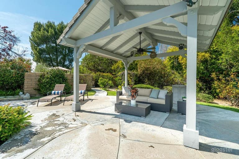  Expansive Outdoor Space with Pool, Lawn, & Bridge 