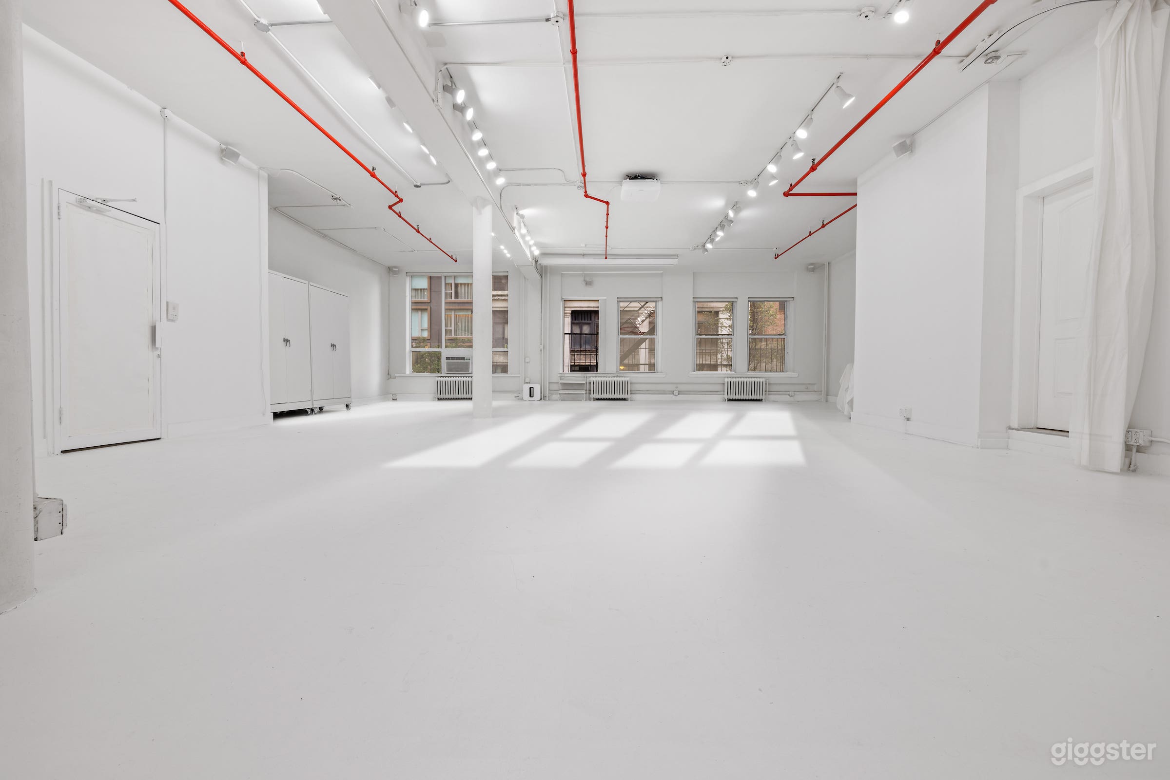 Vast white open loft space with 26' cyclorama wall &amp; hue lightening &amp; sound system.