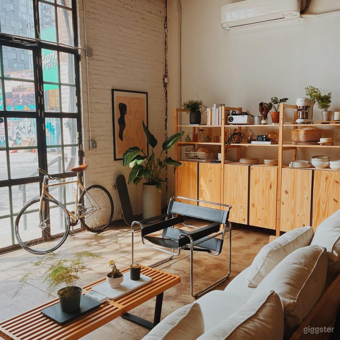 The front of our studio with lots of sunlight and warm wood tones. 