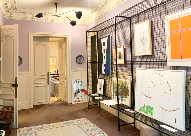  This elegant entrance welcomes guests with intricate Haussmannian details and curated contemporary art, setting the tone for a space where history and creativity converge. 