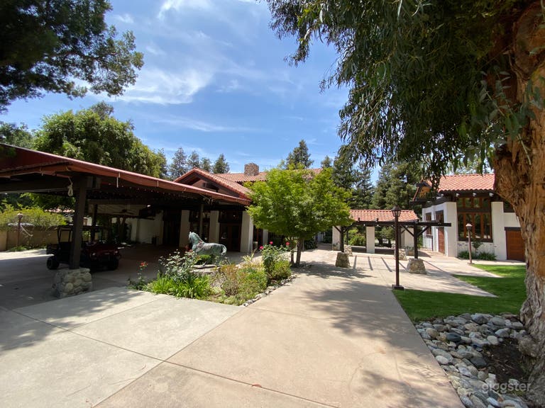  Back Patio with Covered Dining Area and Adjacent Suite with Locker Rooms  