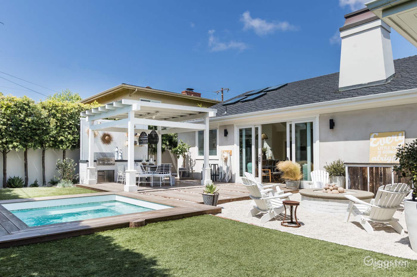 Serene Spool in an Elegant Beach House Setting Photo 1