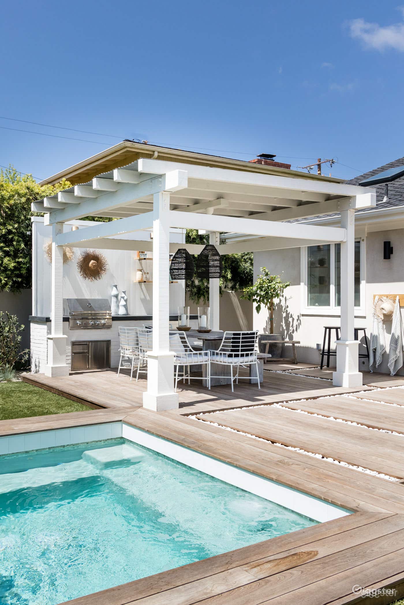 Serene Spool in an Elegant Beach House Setting Photo 3