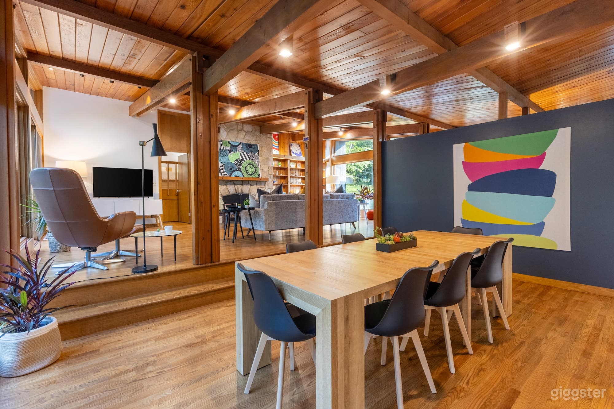 Original post &amp; beam interior. Natural wood floors and vaulted ceiling. Fieldstone fireplace. 