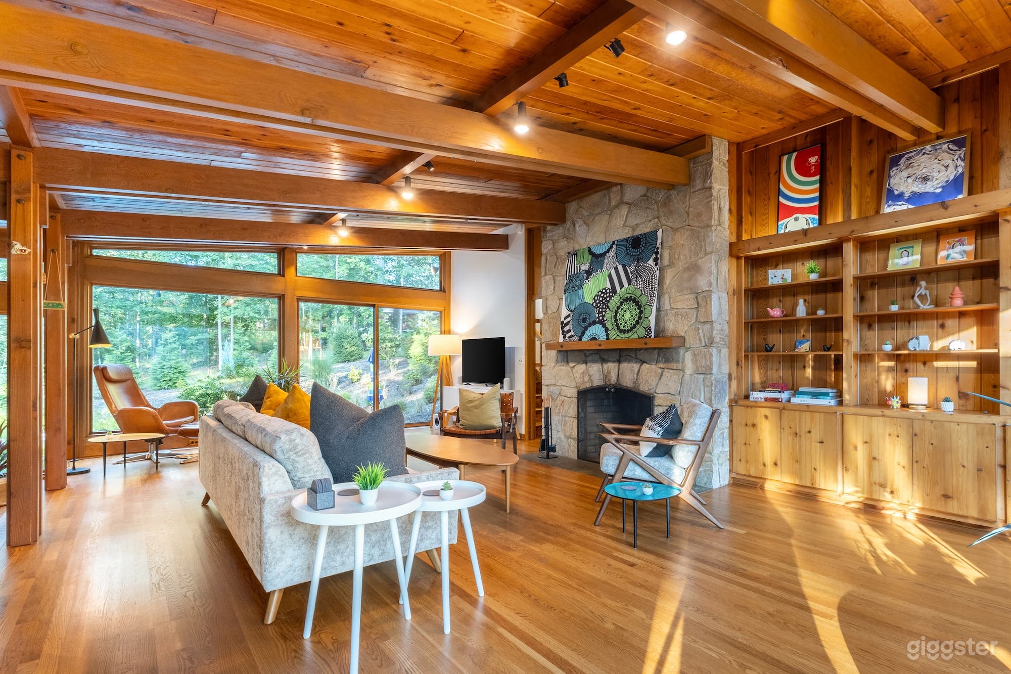 Original post &amp; beam interior. Natural wood floors and vaulted ceiling. Fieldstone fireplace. 