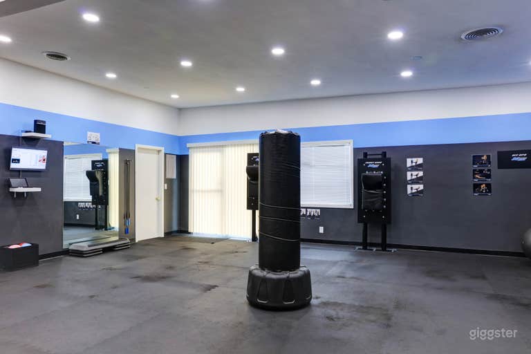  This is one portion of the workout floor which covers 1200 sq ft of the space. Roundhouse bag can be moved to a different position or removed. 