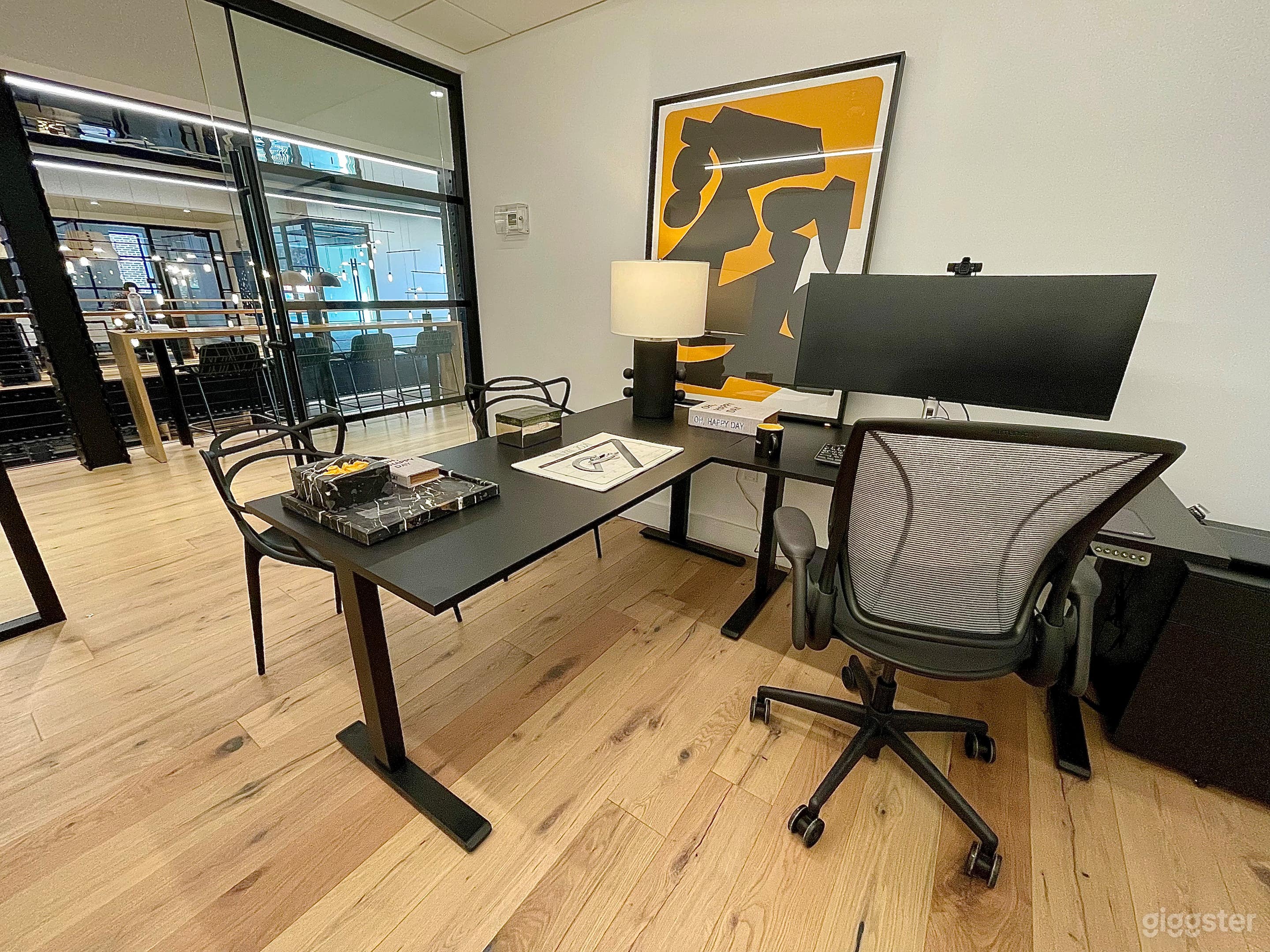 Offices equipped with sit-stand desks and ergonomic chairs. 