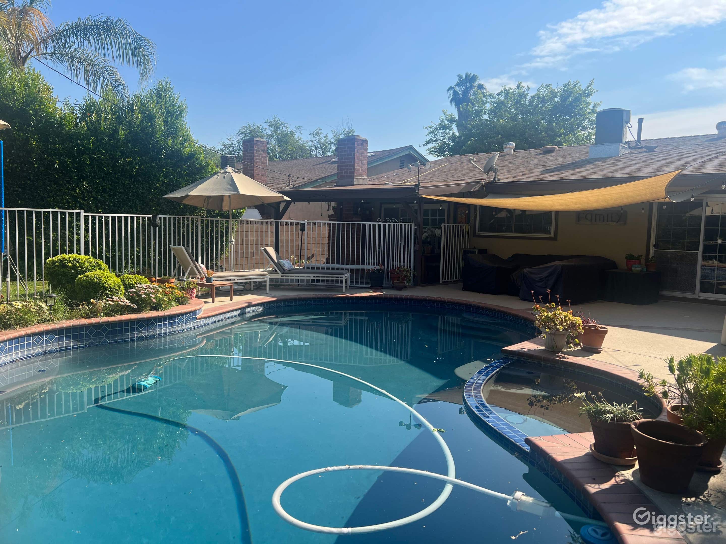 Outdoor Pool with Green Backyard Photo 2
