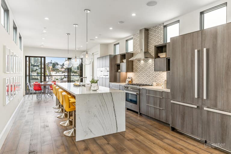  6 bar stools at the island and 6 chairs at the table  