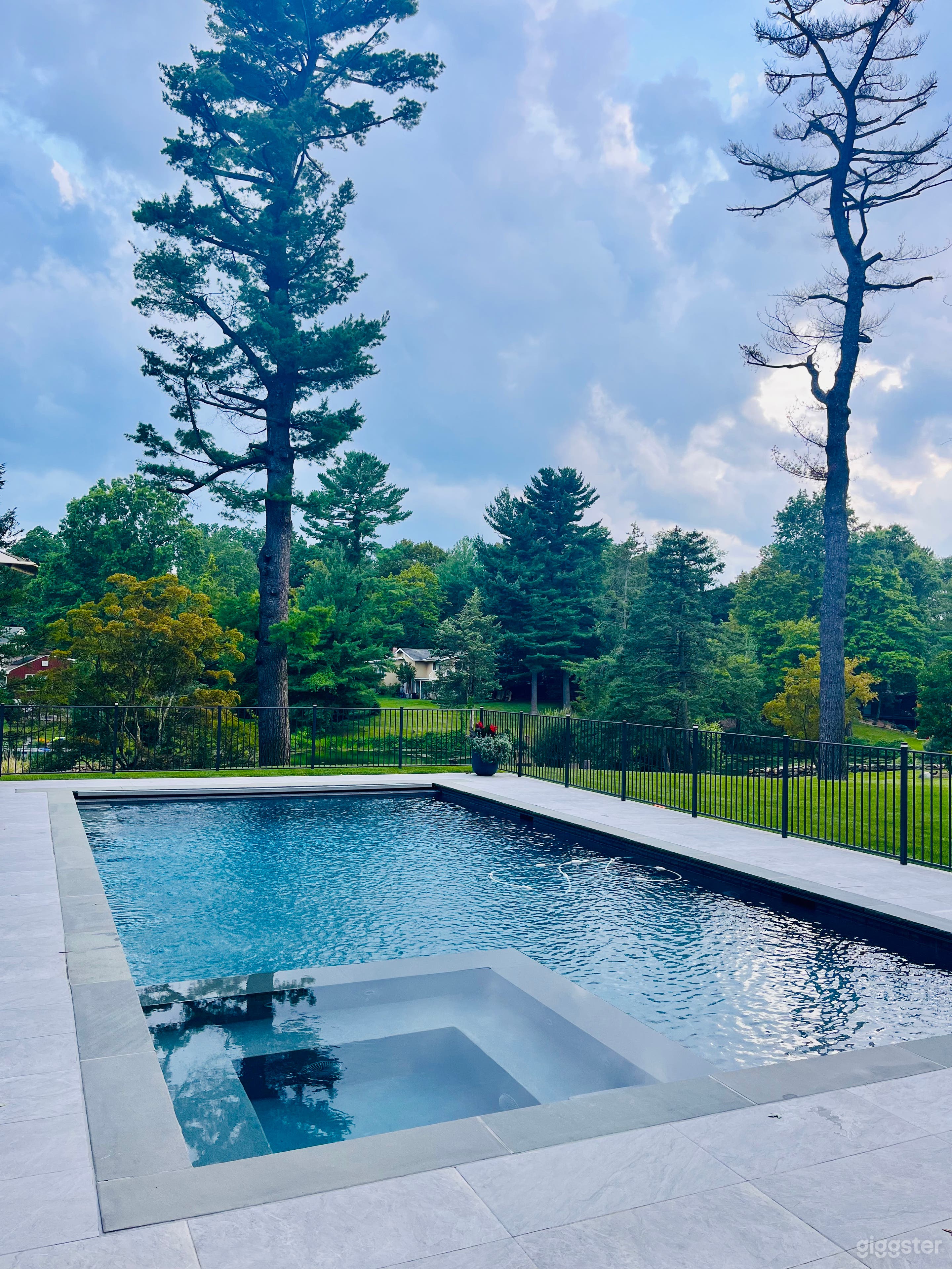 Modern Pool Overlooking Bucolic Pond Photo 2