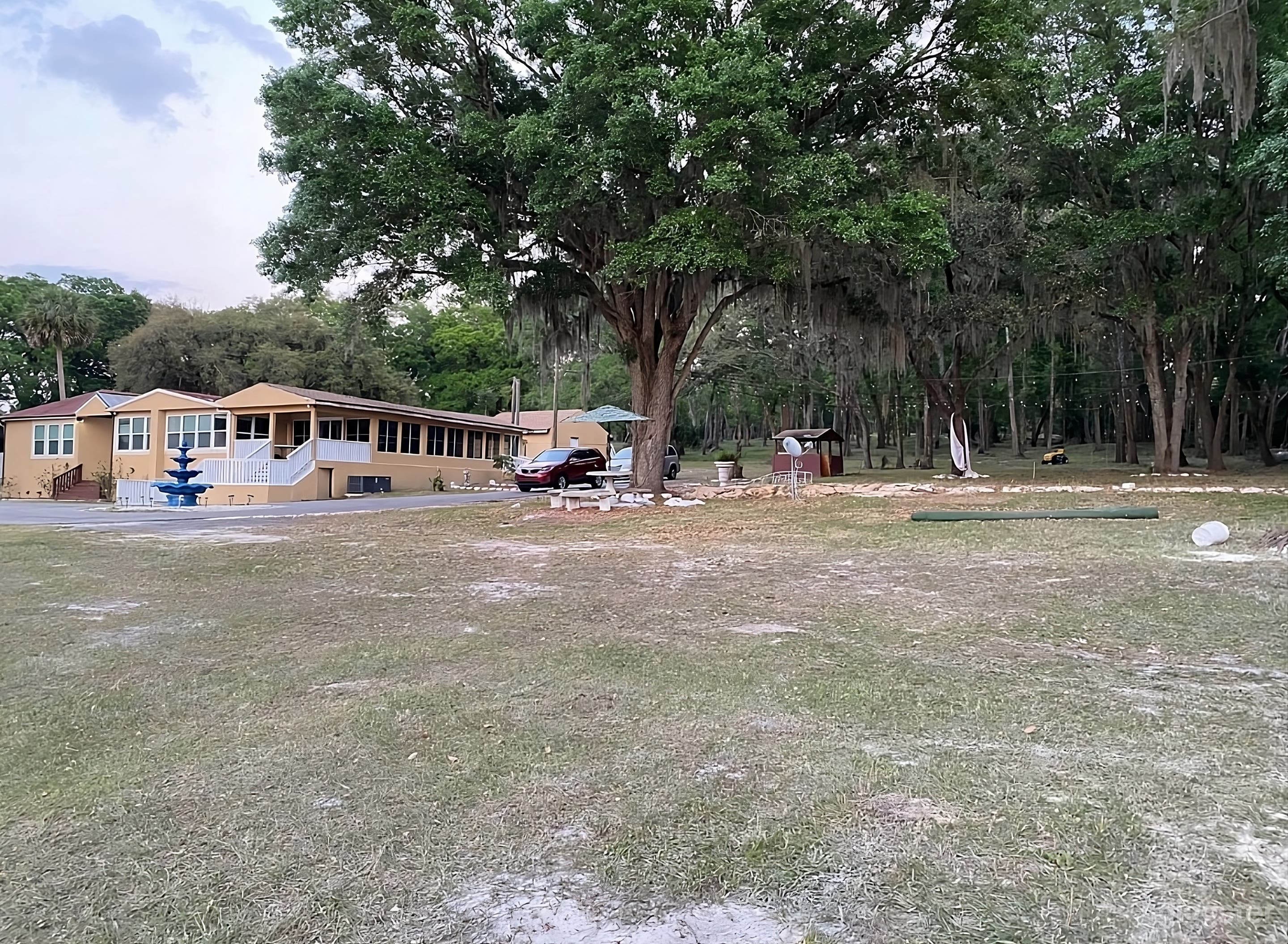 Spacious Backyard Featuring Fountain and Shady Oaks Photo 4