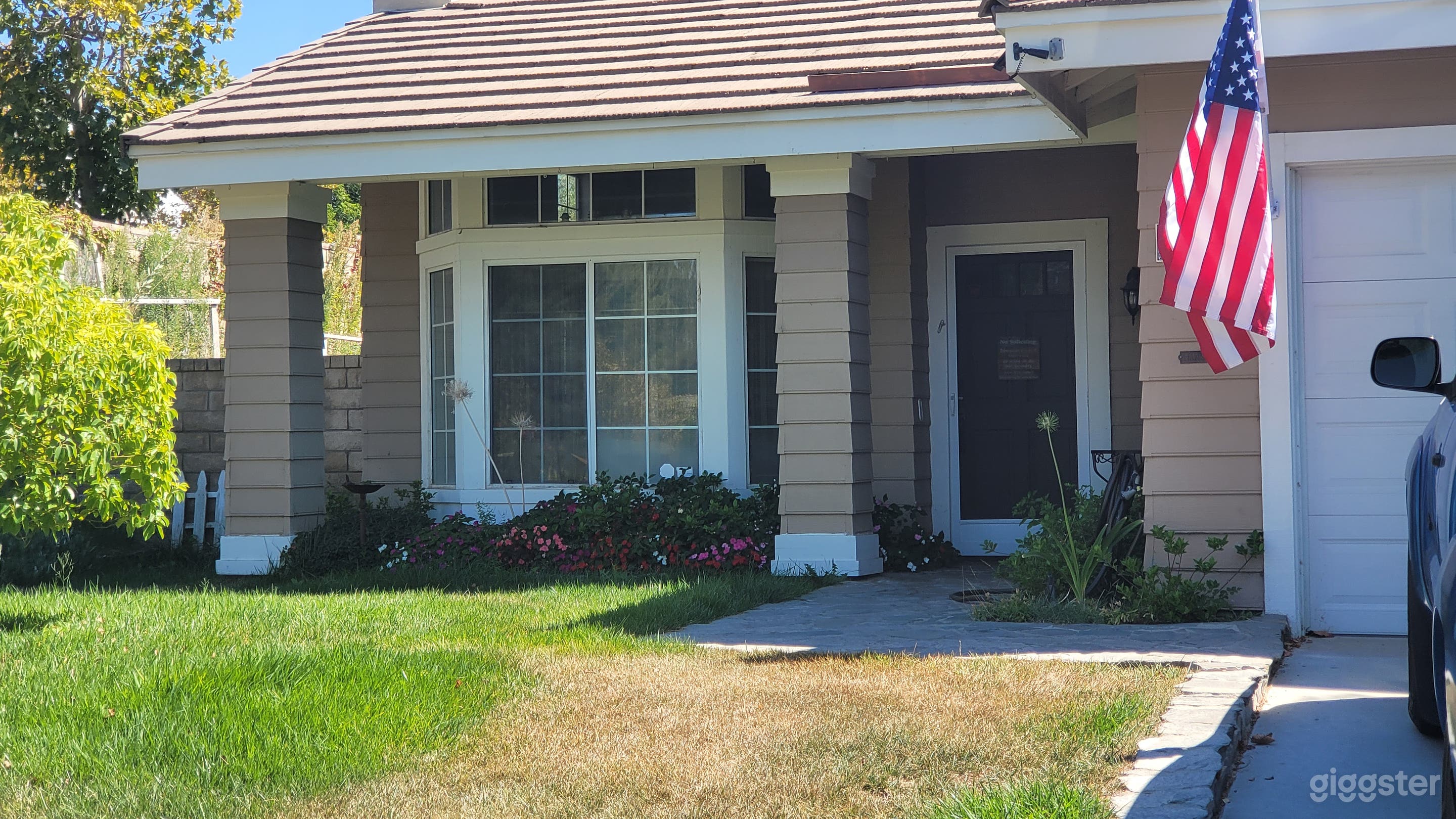 Front yard and entrance from the driveway of our lot. 