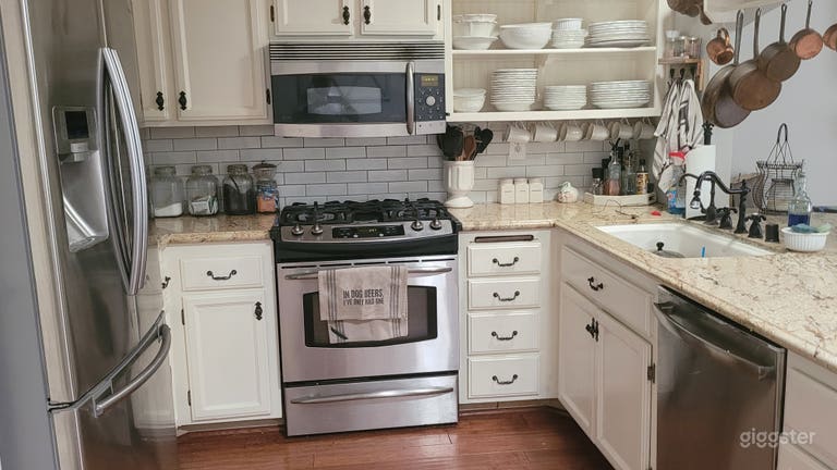  Open stainless steel kitchen with granite counters 