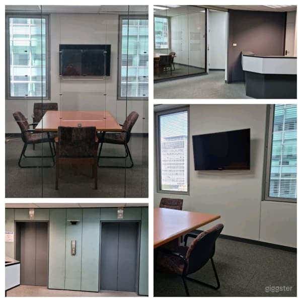 Board Room enclosed with glass doors, table and chairs, tv for presentation accompanied by a beautiful view of the city.